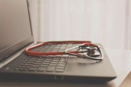 Close up of red stethoscope on desk,Healthcare and medical concept,Selective focusの写真素材