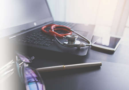Stethoscope red on table,Healthcare and medical concept,Selective focusの写真素材