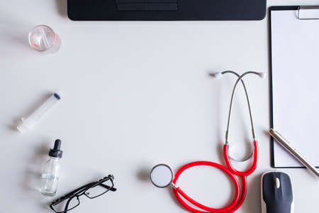 Stethoscope red and syringe,clipbroad,experimental bottle, on white backdround,Healthcare and...