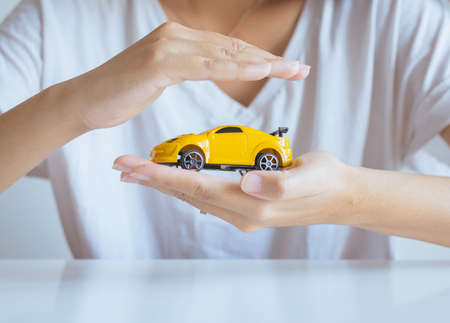Car model on hand,Business and finance conceptの写真素材