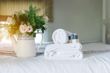 White hotel  towel on bed,Stack of fluffy bath towels の写真素材