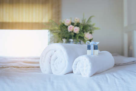 White towels on bedの写真素材