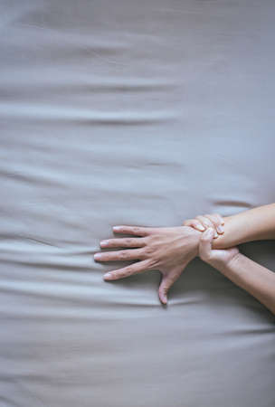 Blood vessel or Varicose veins on hand female on bedroom,Concept Health and skinの写真素材