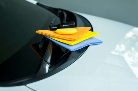 Wipers chamois many color cloth and yellow sponge wax with white carの写真素材