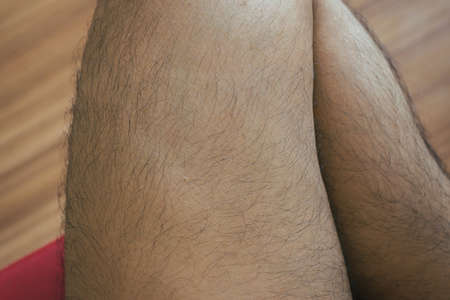 Legs hair of asian man close upの写真素材