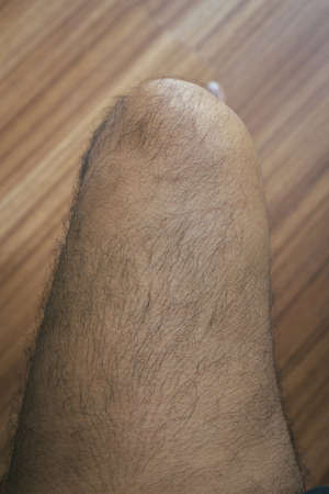 Legs hair of asian man close upの写真素材