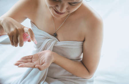 Woman applying moisturizing cream on her hands,Concept healthy and skin