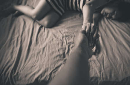 Man giving hand to depressed woman,Mental health care concept,Black and white tonedの写真素材