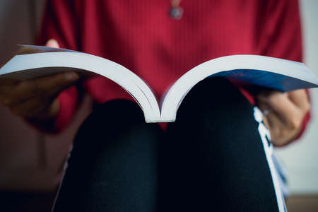 Woman reading a book relax time,Close up and selective focusの写真素材