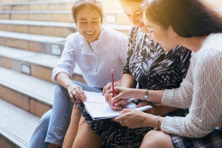 Young teen university student studying and tutor for a test an exam,Education conceptsの写真素材