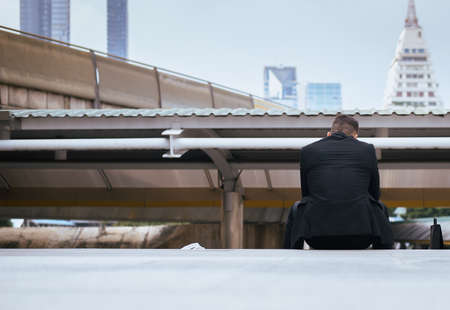 Businessman feeling stressed and tired frustrated failure exhaustedの写真素材