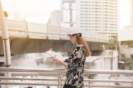 Inspection engineer woman working at construction site outdoorsの写真素材