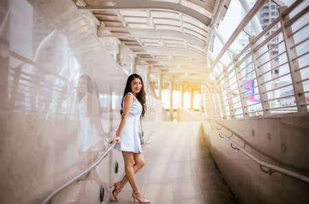 Portrait beautiful woman walking in the city,Happy and smiling,Outdoor lifestyle,Female with...