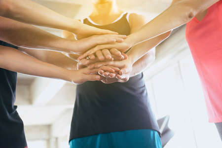 Hand coordination of group people motivated,Sporty team attractive and holding or join hands togetherの写真素材