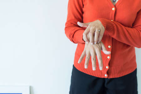 Asian woman scratch itch with her hand,Itching and scratching