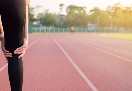 Woman holds on to the knee,Athlete having
pain in the kneeの写真素材