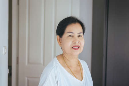 Portrait beautiful elderly asian woman in room,Senior female happy and smiling,Lifestyle...