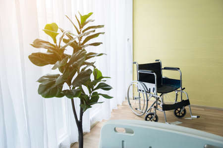 Empty wheel chair for patient in room at hospitalの写真素材