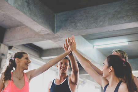 Hand coordination of group people smiling with motivated,Sporty young friendly team attractive and...