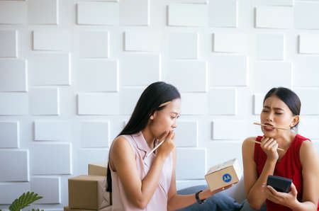 Small business stressed woman owner working at home office,Asian female headache start up entrepreneur sme onlineの写真素材