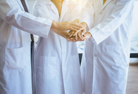 Scientists coordinate hands,Group of diversity people teamwork in laboratory,Successful and reserch...
