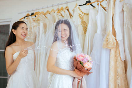 Portrait of beautiful couple LGBT Lesbian asian bride happiness and funny togethe,Ceremony in wedding dayの写真素材