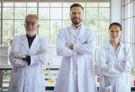 Group of scientist people standing and cross arms together in laboratory,Successful teamwork conceptの写真素材