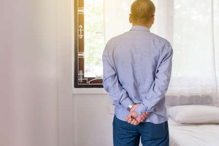 Senior retire asian man having serious depressed and looking something on window, Mental health care conceptの写真素材