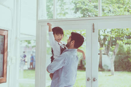 Father and daughter child girl playing,Laughing and funny together at home,Happy loving family