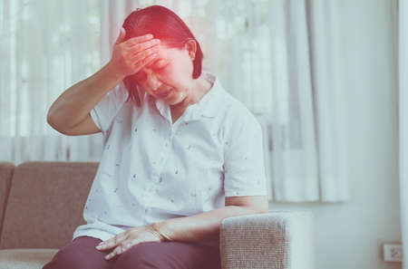 Mature asian elderly woman having migraine and headache pain,Senior healthy concept