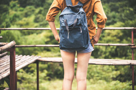 Close up of traveler woman standing and looking beautiful nature at outdoor,Back viewの写真素材