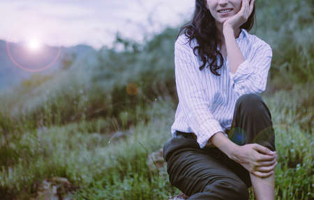 Beautiful woman relaxing and looking something at outdoor,Positive thinking,Vacation concept