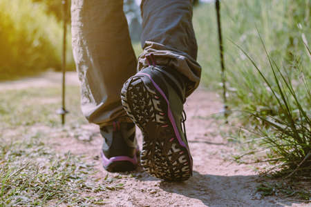 Hiking shoes woman in beautiful rock trail,Hiker trekking or walking at nature,Close upの写真素材
