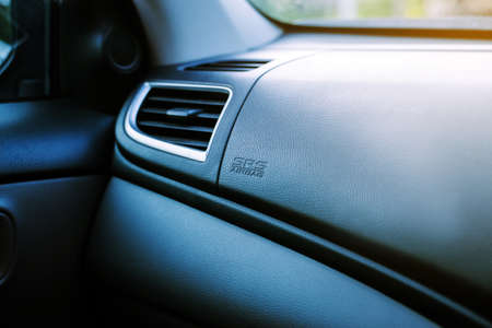 Airbag sign on dashboard in new modern car, Close up, SRS