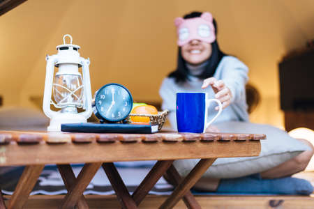 Happy asian woman reach and drinking hot coffee in the morning, Happy and smiling, Relaxing time