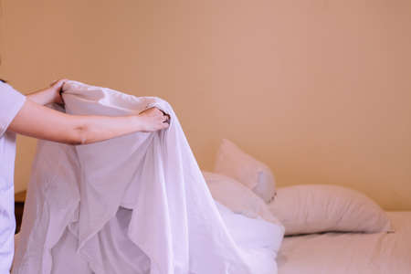 Make a bed, Close up of hands woman making her bed in room after wake up in the morning