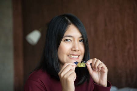 Asian woman using braces teeth or silicone trainer to mouth,Orthodontic,Dental health conceptClose...