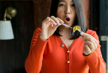 Woman using braces teeth or silicone trainer,Orthodontic,Dental health concept