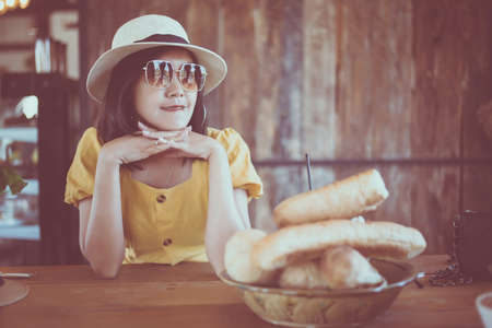 Beautiful smiling woman sitting in coffee shop