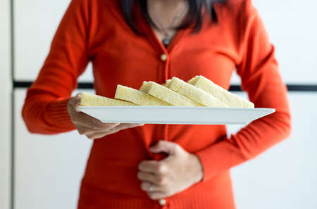 Woman having stomach ache and refusing white bread,Female allergy to bread,Food intolerance defined...