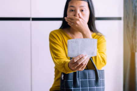 Asian woman using fillter mask protect PM 2.5 because pollution in home,Stay at home,Work from homeの写真素材