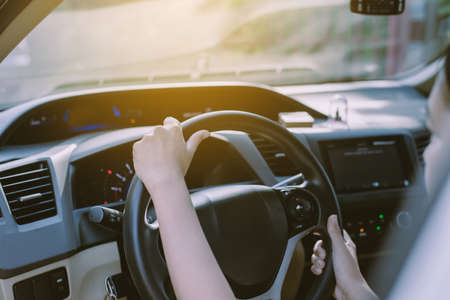Hands woman holding steering wheel,Driving a car on road