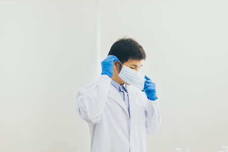 Man doctor or scientist wearing surgical mask for protective coronavirus
