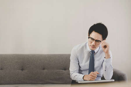Asian man feeling so stressed and tired frustrated failure exhausted,Unemployed conceptの写真素材