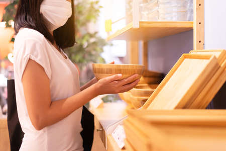 Women wearing surgical face mask and shopping during virus outbreak in department storeの写真素材