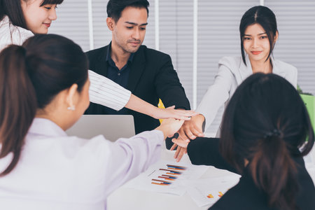 Hands stacking or coordination group of asian people,Business team join hands success for...