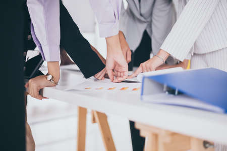 Hands group of people business team pointing to document together,Teamwork planning to profit and...