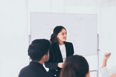 Business asian team discussion work in office,People sharing ideas and discussing project,Brainstorm meeting conceptの写真素材