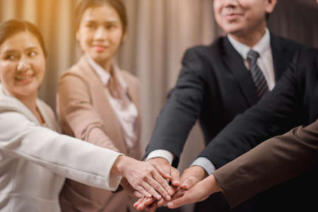 Group of business people join hands success for dealing,Team work to achieve goals,Hand coordinationの写真素材