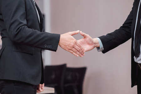 Business success team people shaking hands finishing up after meeting in office,Teamwork successfulの写真素材